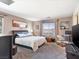 Bedroom with stylish decor, a comfortable bed, and plenty of natural light from the windows at 1124 Aspen Cliff Dr, Henderson, NV 89011