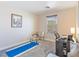 Bright bedroom featuring a desk, yoga mat, and comfortable seating at 1124 Aspen Cliff Dr, Henderson, NV 89011
