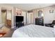 Spacious bedroom featuring a TV, decor, and a luxurious queen-size bed at 1124 Aspen Cliff Dr, Henderson, NV 89011