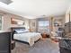 Bedroom with stylish decor, a comfortable bed, and plenty of natural light from the windows at 1124 Aspen Cliff Dr, Henderson, NV 89011