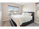 Bedroom features a comfortable bed, blinds, and a view of the neighborhood at 1124 Aspen Cliff Dr, Henderson, NV 89011