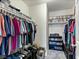 Walk-in closet with ample storage shelving for DVDs and clothing at 1124 Aspen Cliff Dr, Henderson, NV 89011