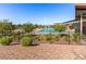 Community pool area with sun loungers, shade structures, and desert plants for relaxation and recreation at 1124 Aspen Cliff Dr, Henderson, NV 89011