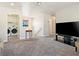 Second story Gathering room with carpet and view of laundry room at 1124 Aspen Cliff Dr, Henderson, NV 89011