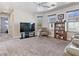 Large second story living room with carpet and view of exterior at 1124 Aspen Cliff Dr, Henderson, NV 89011