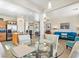 Bright and airy living space with open layout, connecting to the kitchen and dining area at 1124 Aspen Cliff Dr, Henderson, NV 89011