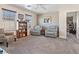 Comfortable living room with neutral decor, ceiling fan and ample natural light at 1124 Aspen Cliff Dr, Henderson, NV 89011