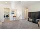 Second story Gathering room with carpet and view of laundry room at 1124 Aspen Cliff Dr, Henderson, NV 89011