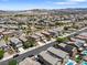 An expansive neighborhood displaying a variety of homes and desert landscaping with mountain views in the distance at 1124 Aspen Cliff Dr, Henderson, NV 89011