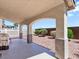 Covered patio area with a grill and desert landscaping at 1124 Aspen Cliff Dr, Henderson, NV 89011