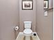 Small half-bath includes a standard toilet and wall art at 1124 Aspen Cliff Dr, Henderson, NV 89011