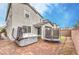 Paver backyard featuring a hot tub, trampoline, and covered patio, great for leisure and entertainment at 1267 Dorado Sea Ct, Henderson, NV 89052