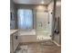 Bathroom features a walk-in shower, soaking tub, and modern vanity with ample cabinet space at 1267 Dorado Sea Ct, Henderson, NV 89052