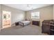 Cozy bedroom features neutral decor and a view of an attached bathroom at 1267 Dorado Sea Ct, Henderson, NV 89052