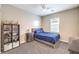 Bedroom with grey and blue furniture and a view of the window at 1267 Dorado Sea Ct, Henderson, NV 89052