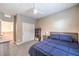 Bedroom with blue bedding, closet, and ceiling fan at 1267 Dorado Sea Ct, Henderson, NV 89052