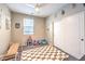 Cozy bedroom with a ceiling fan, closet, and window for natural light, designed for children at 1267 Dorado Sea Ct, Henderson, NV 89052