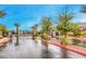 View of the community entrance featuring a gate, trees, and well maintained landscaping at 1267 Dorado Sea Ct, Henderson, NV 89052