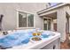 Close up of a hot tub on a patio with two glasses of champagne at 1267 Dorado Sea Ct, Henderson, NV 89052