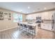 Bright kitchen featuring granite countertops, stainless appliances, and a large island with bar seating at 1267 Dorado Sea Ct, Henderson, NV 89052