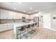 Modern kitchen with white cabinets, granite countertops, and stainless steel appliances at 1267 Dorado Sea Ct, Henderson, NV 89052
