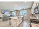Modern kitchen featuring granite countertops, stainless steel appliances, and an open concept living space at 1267 Dorado Sea Ct, Henderson, NV 89052