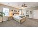 The main bedroom features carpet, a ceiling fan, and a decorative headboard and trim at 1267 Dorado Sea Ct, Henderson, NV 89052