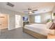 Cozy main bedroom with carpet, ceiling fan, and natural light from one window at 1267 Dorado Sea Ct, Henderson, NV 89052