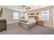 Spacious main bedroom featuring a large bed, ceiling fan and natural lighting at 1267 Dorado Sea Ct, Henderson, NV 89052