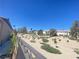 Community with desert landscaping and trees viewed from the backyard at 138 Short Grass Ave, Las Vegas, NV 89148