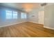 Bedroom with wood floors, plantation shutters, and modern lighting at 138 Short Grass Ave, Las Vegas, NV 89148
