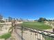 Backyard view of the golf course with lush green grass at 138 Short Grass Ave, Las Vegas, NV 89148