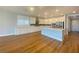 Bright kitchen boasts white cabinets, stainless steel appliances, and island seating at 138 Short Grass Ave, Las Vegas, NV 89148