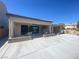 Large concrete patio with covered area offers ample room for outdoor dining at 138 Short Grass Ave, Las Vegas, NV 89148