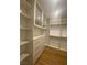 Walk-in closet featuring custom cabinets and shelves at 138 Short Grass Ave, Las Vegas, NV 89148