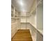 Spacious walk-in closet with custom shelving, drawers, and storage at 138 Short Grass Ave, Las Vegas, NV 89148