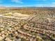 An aerial view of a neighborhood showcasing the community layout and its proximity to nearby amenities and cityscape at 1813 Arch Stone Ave, North Las Vegas, NV 89031