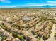 An aerial view of a desert neighborhood highlighting a home's location with its street address at 1813 Arch Stone Ave, North Las Vegas, NV 89031
