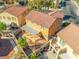 An aerial view of a home with an orange tile roof, backyard patio, and desert landscaping at 1813 Arch Stone Ave, North Las Vegas, NV 89031