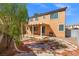 A home's backyard with a covered patio, minimal landscaping, and an outdoor grill at 1813 Arch Stone Ave, North Las Vegas, NV 89031