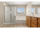 Bathroom featuring a tub with shower, tiled floors, window and vanity with plenty of storage at 1813 Arch Stone Ave, North Las Vegas, NV 89031