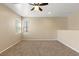 Spacious bedroom with a ceiling fan and a large window providing ample natural light at 1813 Arch Stone Ave, North Las Vegas, NV 89031