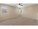Spacious bedroom featuring neutral colors, carpet, recessed lighting, and multiple windows that bring in natural light at 1813 Arch Stone Ave, North Las Vegas, NV 89031