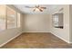 Bright dining room showcasing tiled floors, large windows with blinds, and a contemporary ceiling fan at 1813 Arch Stone Ave, North Las Vegas, NV 89031