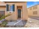 A close-up of the front door highlighting the entry's architectural details, color, and surrounding landscape at 1813 Arch Stone Ave, North Las Vegas, NV 89031