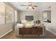Inviting living room with tile floors, neutral paint, modern furniture, and lots of natural light at 1813 Arch Stone Ave, North Las Vegas, NV 89031