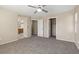 This cozy main bedroom features neutral walls, soft carpet, and access to an ensuite bath and closet at 1813 Arch Stone Ave, North Las Vegas, NV 89031