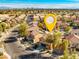 A neighborhood street view featuring the house, trees, landscaping, and a yellow pinpoint at 1813 Arch Stone Ave, North Las Vegas, NV 89031
