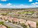 Panoramic aerial shot of a suburban neighborhood featuring well-maintained homes and a golf course at 1964 Oliver Springs St, Henderson, NV 89052