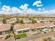 Expansive aerial view of a vibrant community with lush landscaping and mountain views at 1964 Oliver Springs St, Henderson, NV 89052